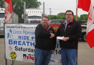 Brandt Bessant receives the prize for Best Poker Hand from James Sewell, President, Kinsmen Club of Brandon. Brandt also won the Show and Shine Best Car prize.